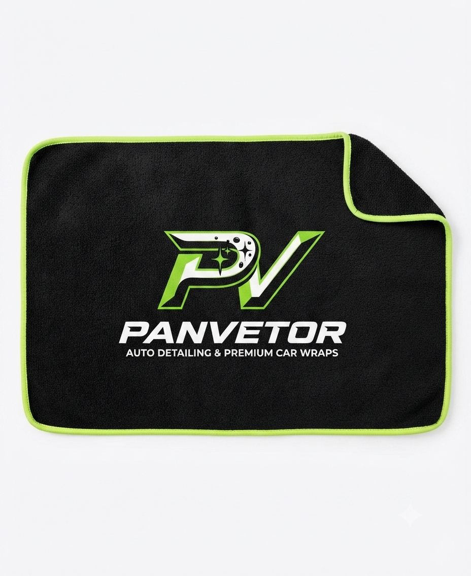 Black microfiber towel with green edge and Panvetor logo